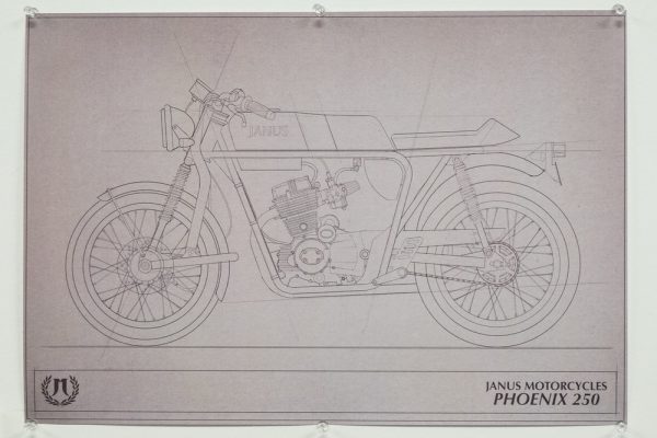 Technical blueprint of Janus Motorcycles Phoenix 250 on display.