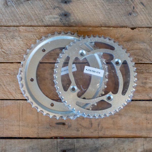 Bicycle chainrings on wooden background