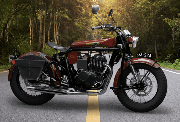 Classic red motorcycle parked on a forest roadside.