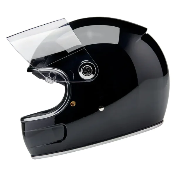 Black motorcycle helmet with clear visor on white background.